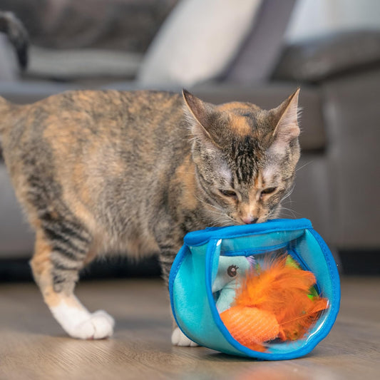 Blue mesh fish bowl toy with plush orange fish inside, on a wooden floor