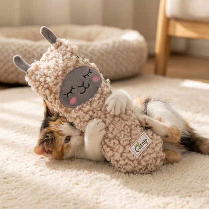Llama-shaped plush catnip toy with closed-eye face and small label