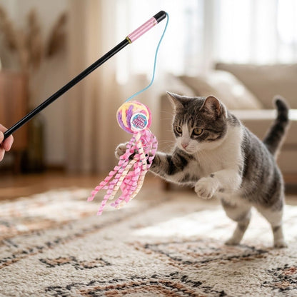 Wool ball cat wand with pink ribbon streamers and striped wand handle