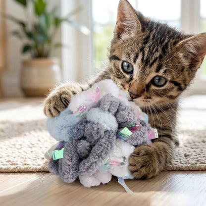 Fluffy yarn crinkly ball with gray, white, and pastel ribbon pom details