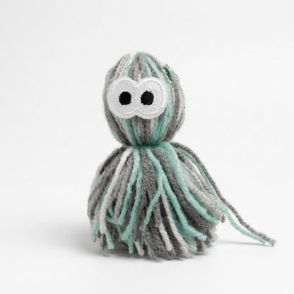 Plush yarn octopus with white cloud face and mint-gray striped dangling tentacles