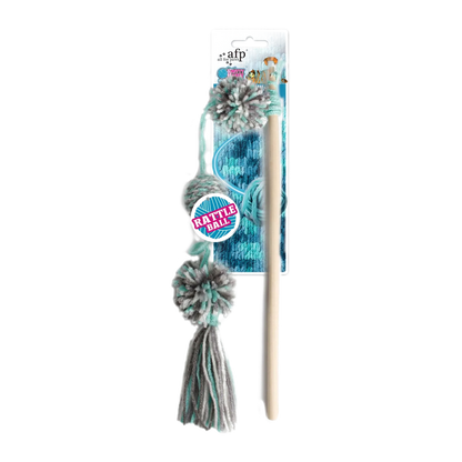 Cat toy wand with yarn pom-poms on blue backing card, white handle