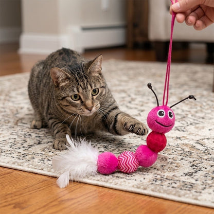 Pink plush feather snake cat toy with striped body and white fuzzy feather tail