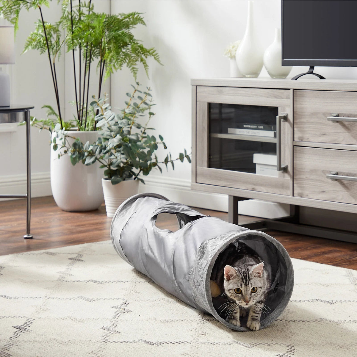 Best Friends by Sheri Ilan Cat Tunnel — grey tunnel in a living room