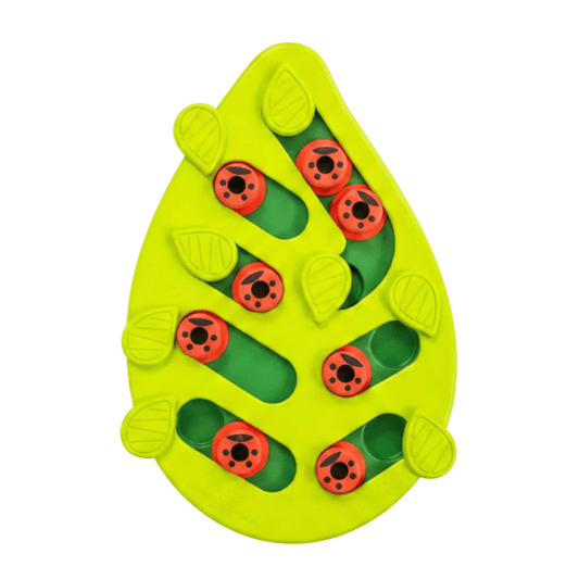 Leaf-shaped green cat puzzle treat feeder with red ladybug pegs on a white background