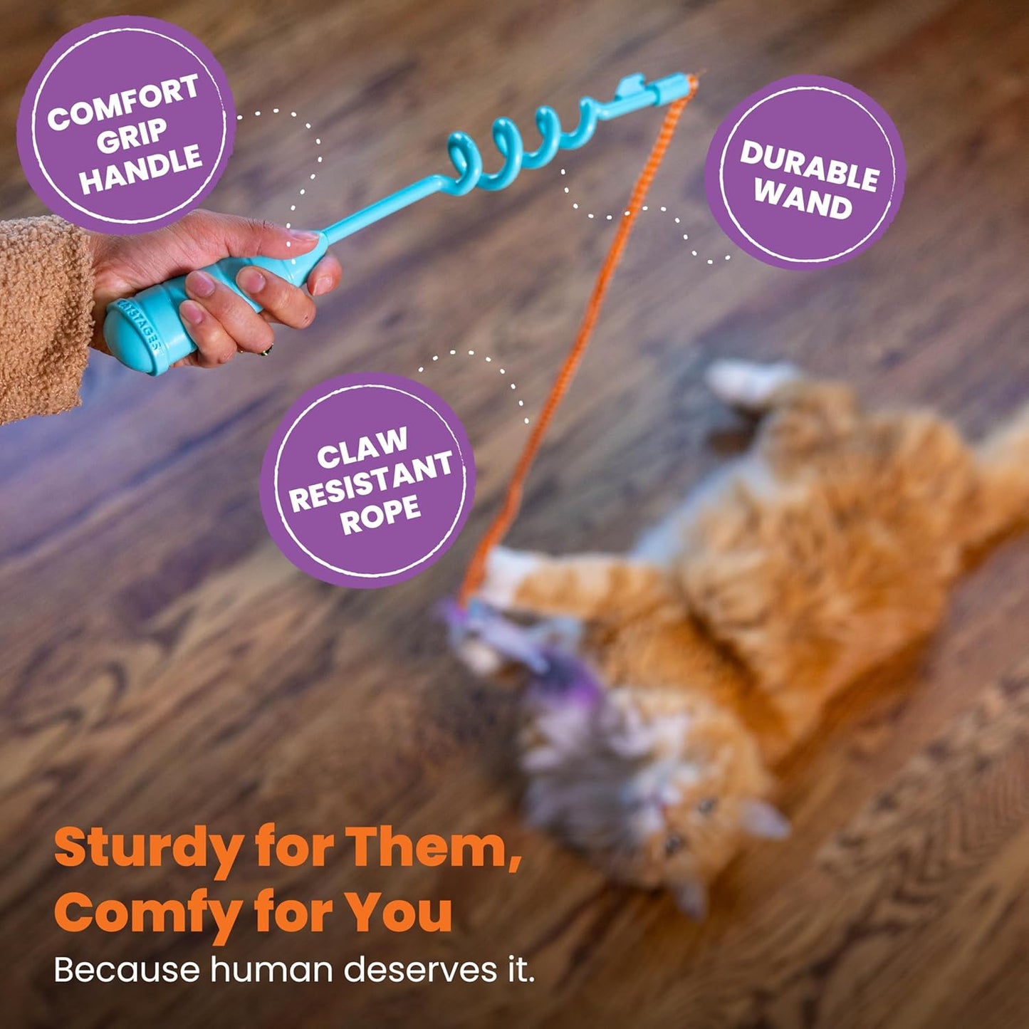 Cat teaser wand with teal spring grip, orange cord, gray mouse plush, and purple pom ball