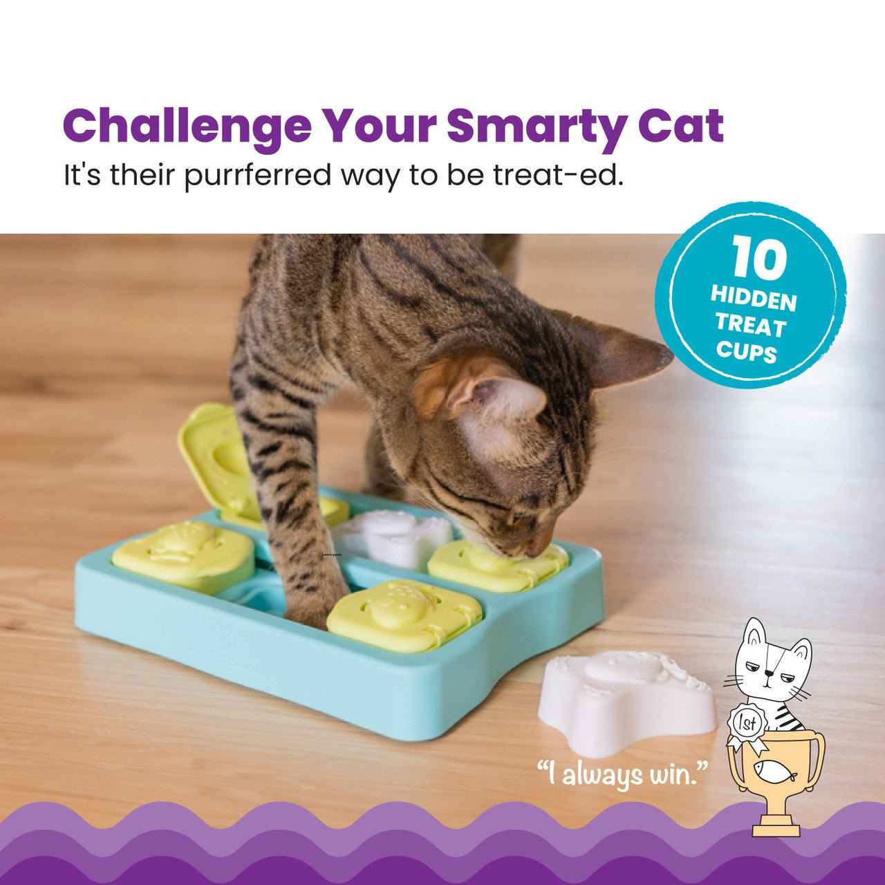 Blue cat treat puzzle with green compartments and tabs, used by a tabby cat
