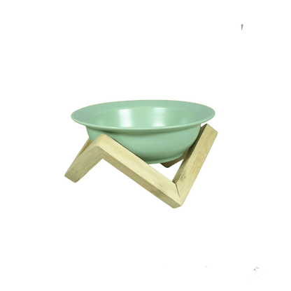 Mint green ceramic cat bowl on bamboo elevated stand with three legs