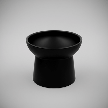 Black tilted ceramic cat bowl, empty and smooth glazed finish