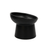Black tilted ceramic cat bowl, side view; shallow bowl with wide rim on pedestal base.
