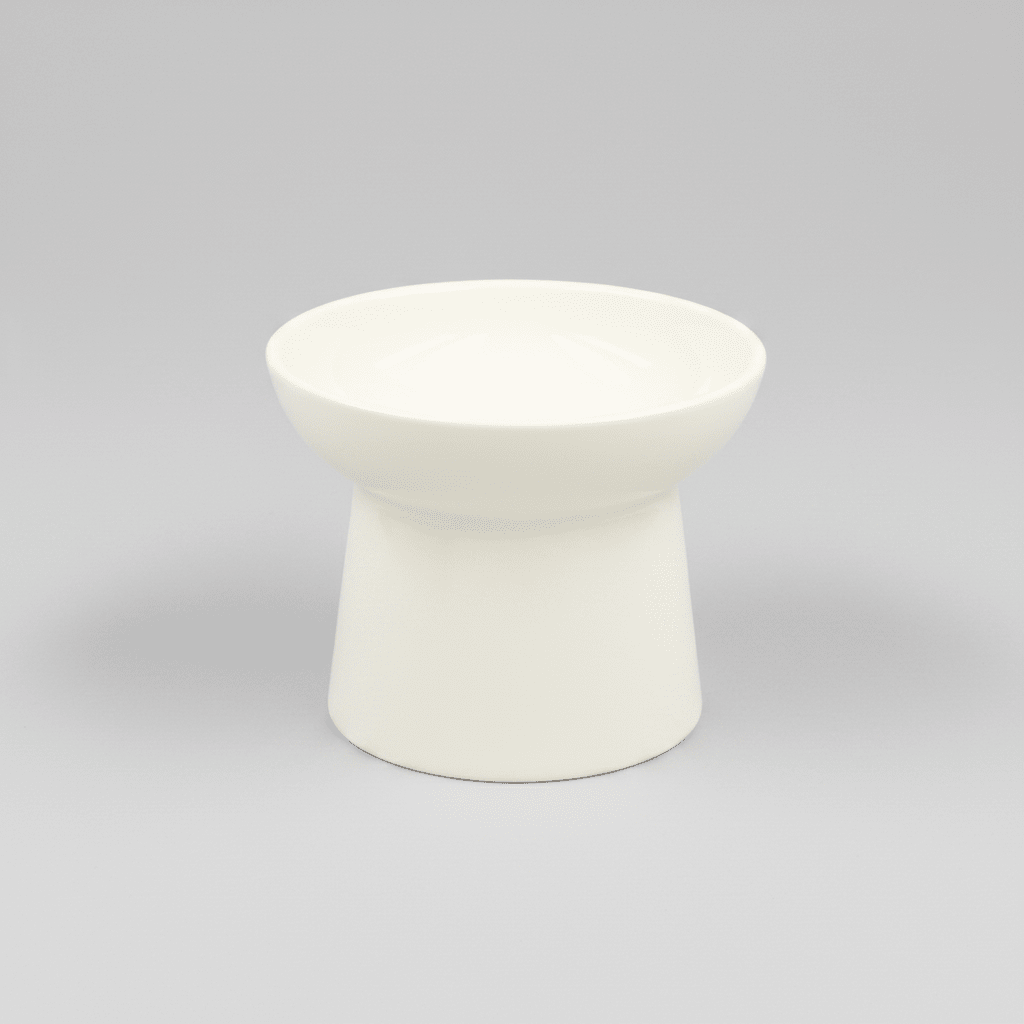 White tilted ceramic cat bowl, empty with a smooth rounded rim