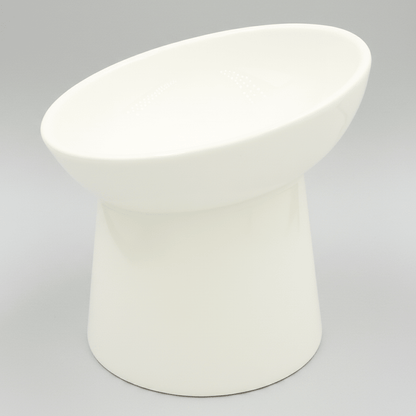 White tilted ceramic cat bowl, empty and smooth glazed finish