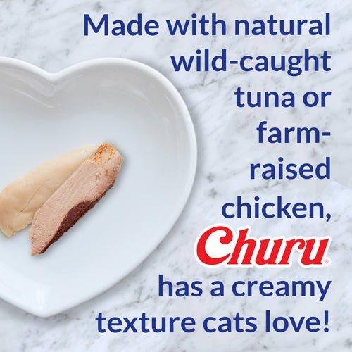 Cat hairball control chicken treat, creamy paste on pellets in white bowl