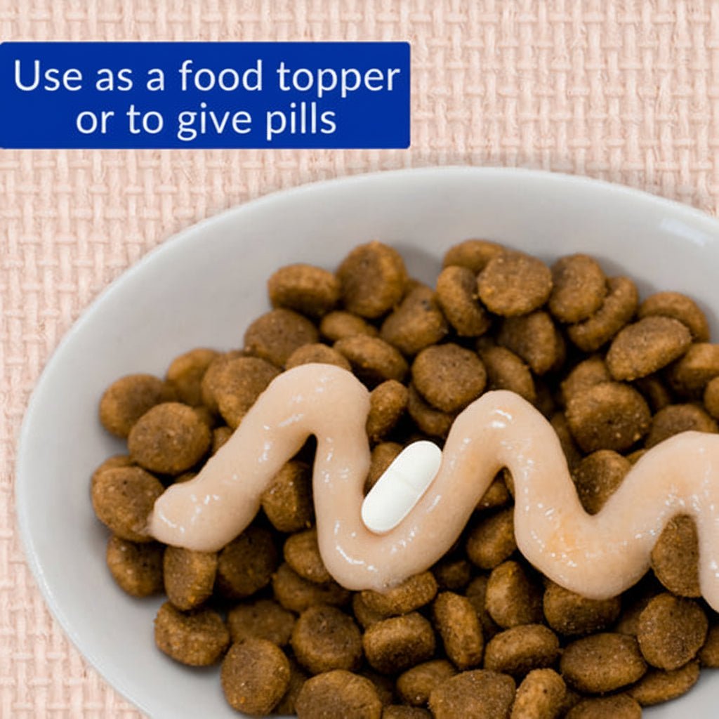 Cat food topper with crunchy kibble and creamy treat paste