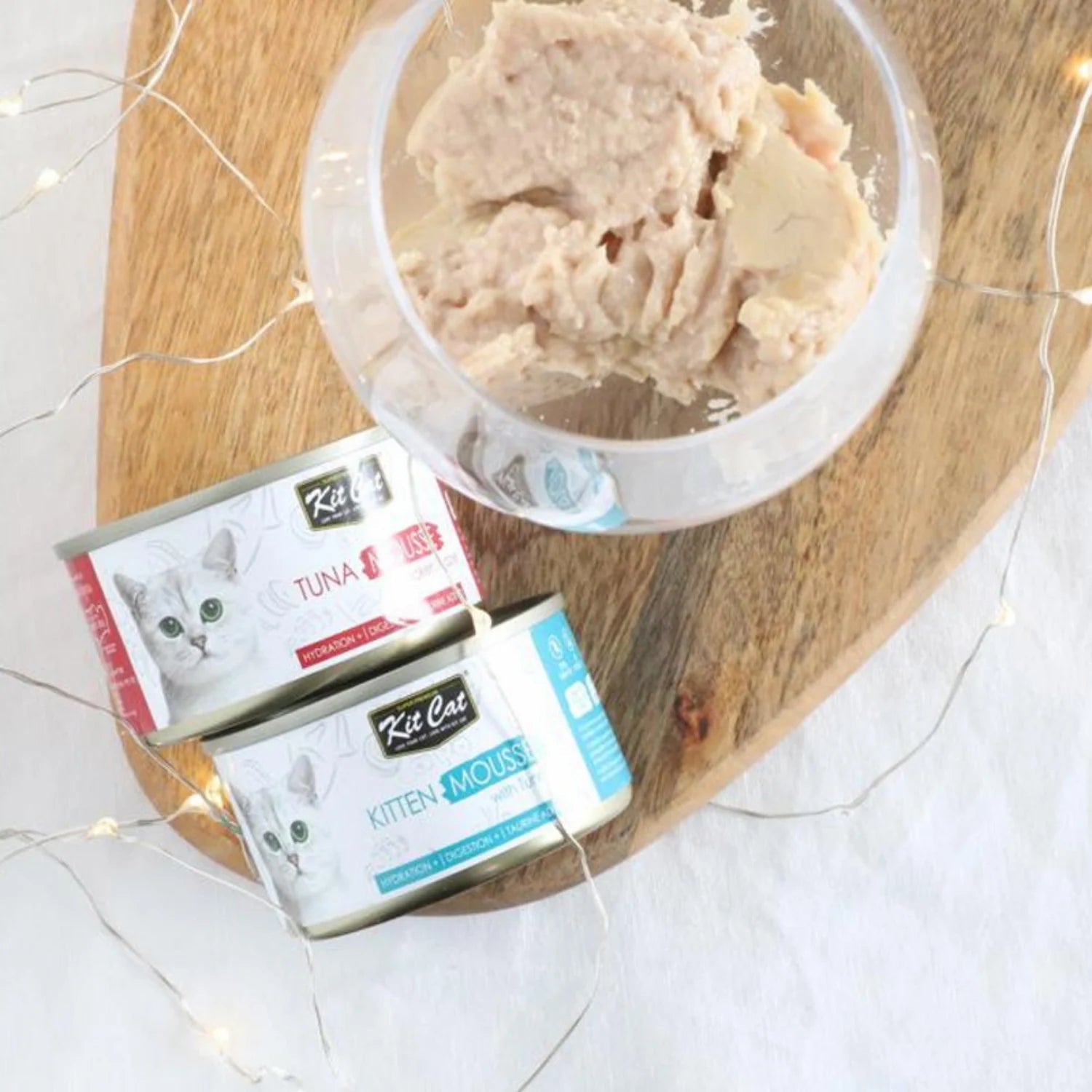 Kit Cat canned cat food variety pack with mousse in a bowl on a plate