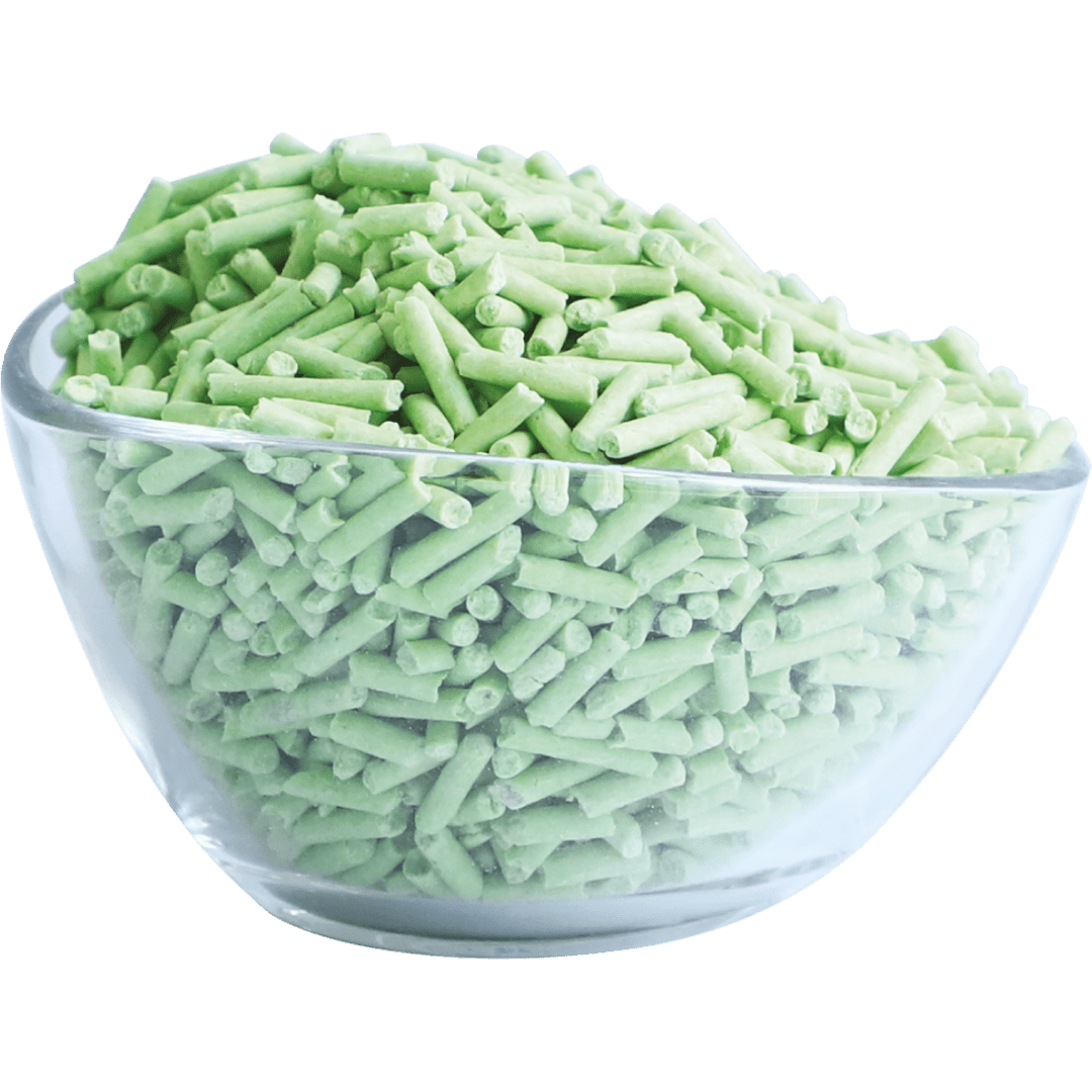 Soy clumping cat litter pellets in a light green bowl
