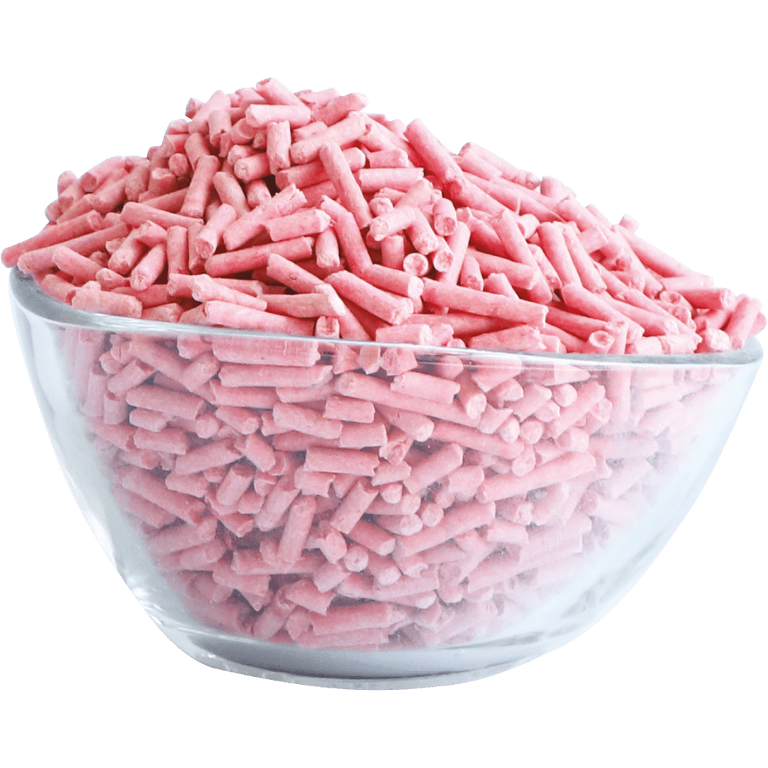 Pink soya clumping cat litter pellets in a clear bowl