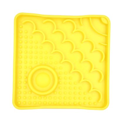 Yellow LickiMat Catster slow feeder with raised cloud pattern and circular center