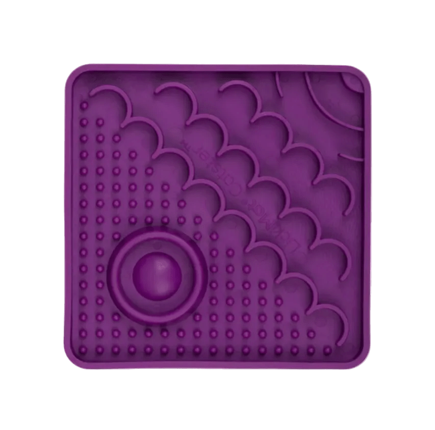 Purple LickiMat Catster slow feeder mat with oval center and bubble nubs