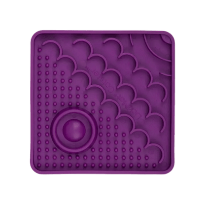 Purple LickiMat Catster slow feeder mat with oval center and bubble nubs