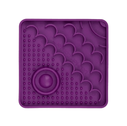 Purple LickiMat Catster slow feeder mat with oval center and bubble nubs