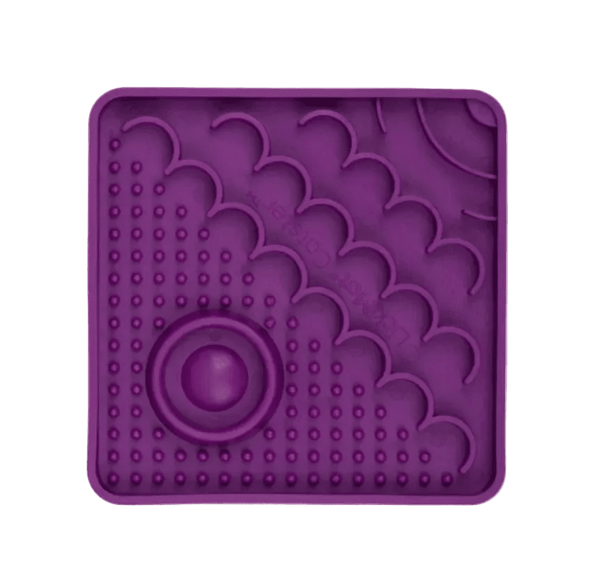 Purple LickiMat Catster slow feeder mat with oval center and bubble nubs