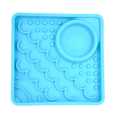 LickiMat® Kitty slow feeder for kittens in turquoise blue, with raised lick nubs and dish