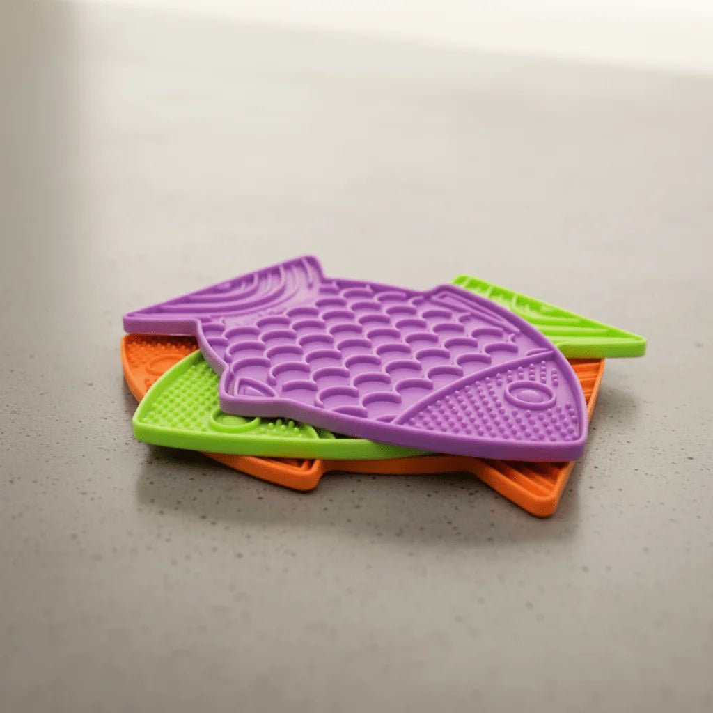 Purple cat slow feeder fish mat with raised lick nubs and ridged channels