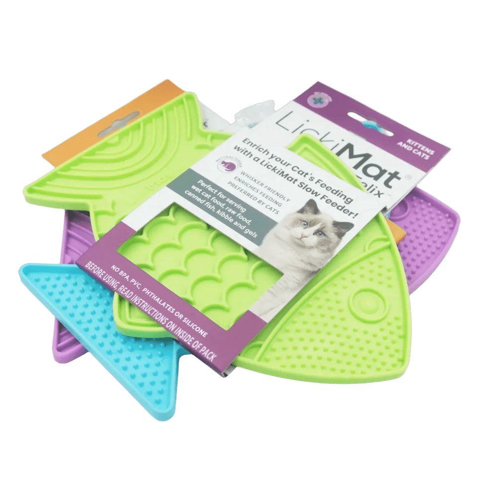 Cat slow feeder fish mats in purple, lime green, and blue with product packaging