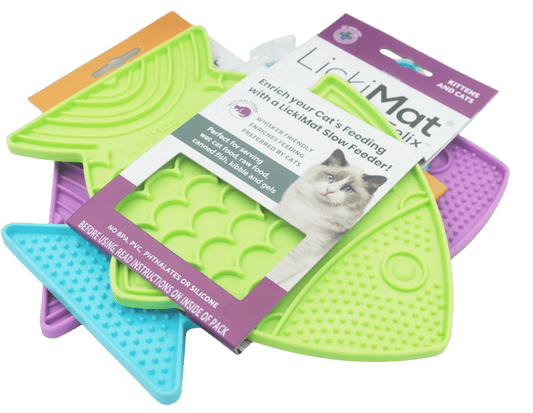 Cat slow feeder fish mats in purple, lime green, and blue with product packaging