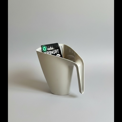 Off-white cat litter scoop with curved handle and perforated sifting edge