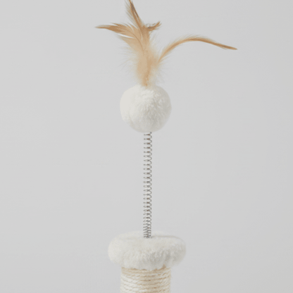 Small kitten cat tree with cream posts, white pom balls, and feather toy on top