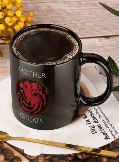 Black ceramic coffee mug with red cat emblem and 'MOTHER OF CATS' text