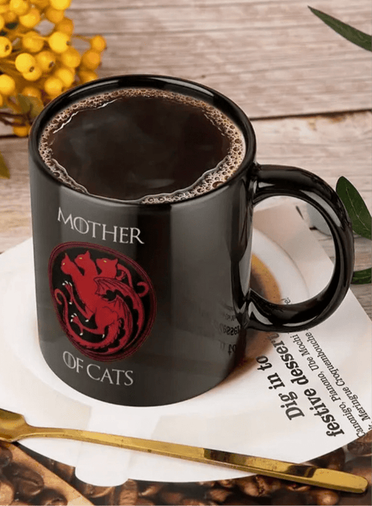 Black ceramic coffee mug with red cat emblem and 'MOTHER OF CATS' text