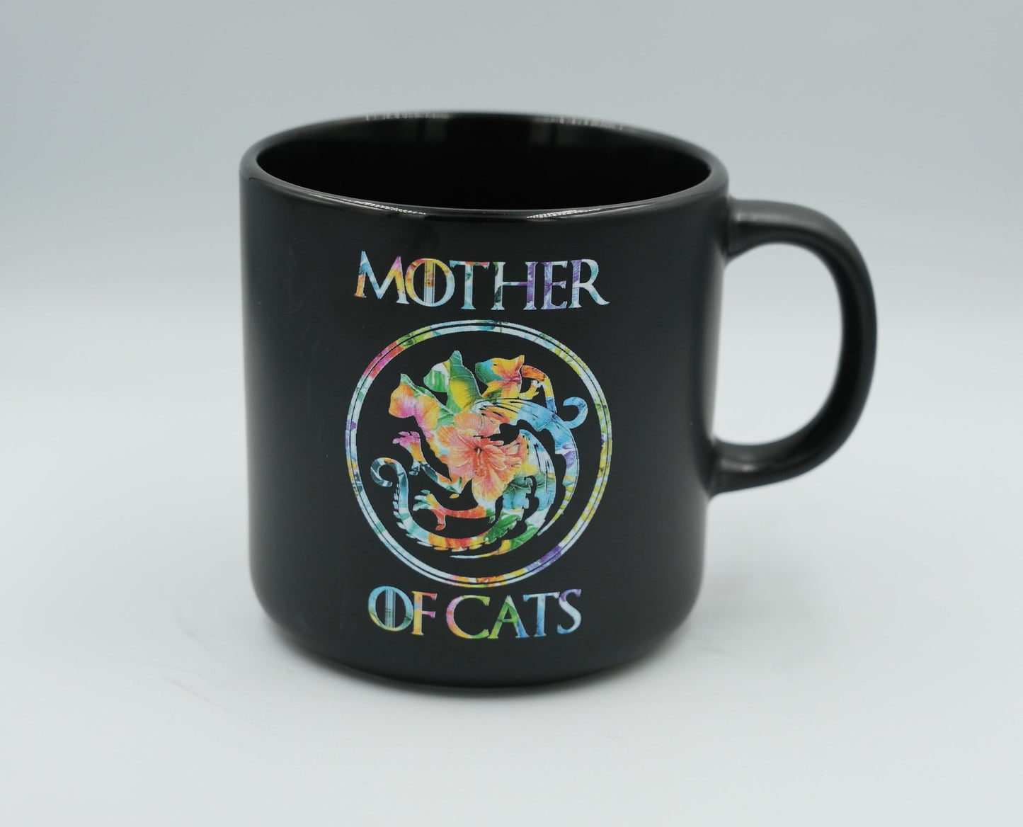 Black Mother of Cats mug with colorful floral cat wreath design and handle