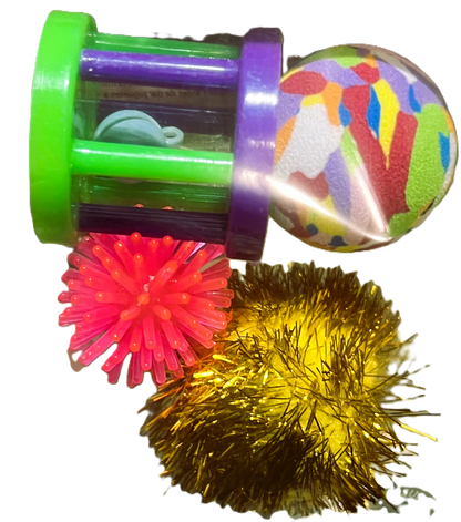 Cat toy set pieces: green wand with purple hub, rainbow plush ball, pink and gold pom-poms