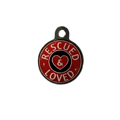 Round metal cat ID tag with 'Rescued & Loved' heart text on red.