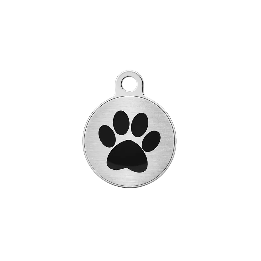 Round metal cat ID tag with black paw print on brushed silver background.