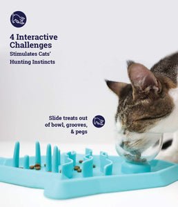 Teal shark-shaped interactive snack mat with raised pegs and treat wells