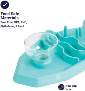Teal shark-shaped pet snack mat with clear cup insert and raised pegs