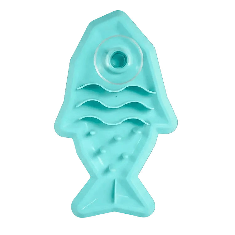 Teal shark-shaped pet snack mat with round top well and textured peg base
