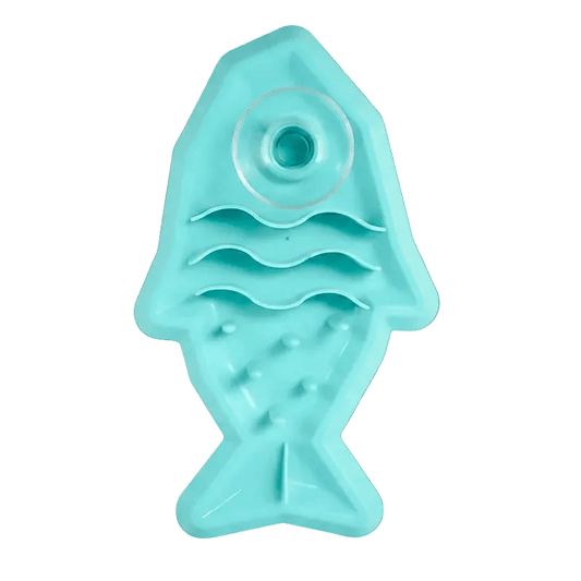 Teal shark-shaped pet snack mat with round top well and textured peg base
