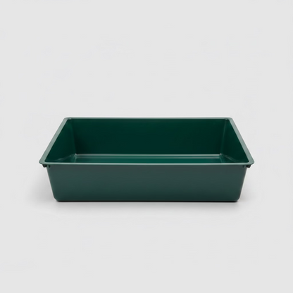 Green plastic cat litter tray with low sides and open top