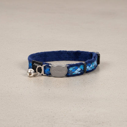 Blue cat safety collar with padded lining, silver buckle, and small bell attachment.
