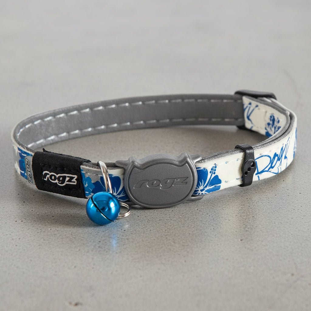 Safety release cat collar with blue floral fabric, gray clasp, and blue bell