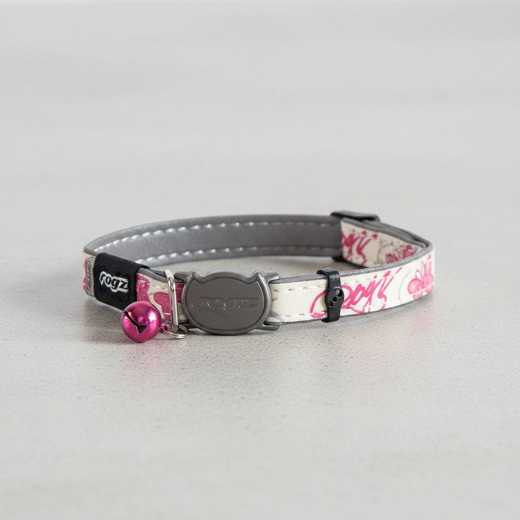 Safety release cat collar with pink butterfly print, gray clasp, and pink bell