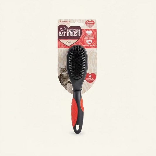 Cat brush with black bristles and red-orange textured handle