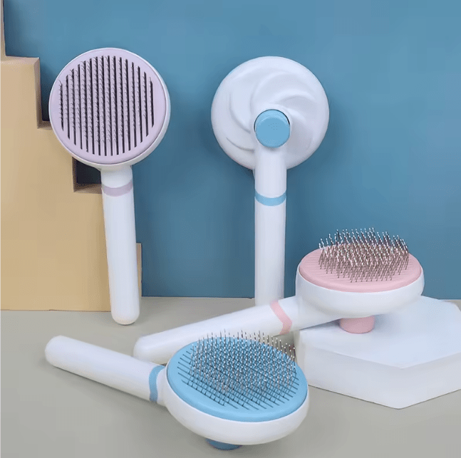 Pet grooming brush collection with oval self-cleaning heads and comfort grips