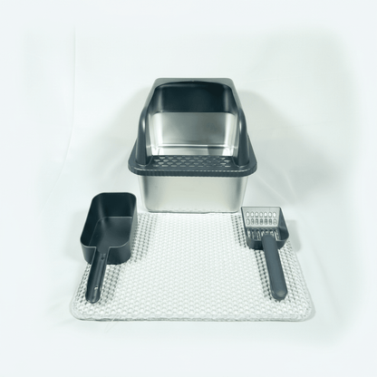 Black cat litter box with scoop and textured mat for catching litter.