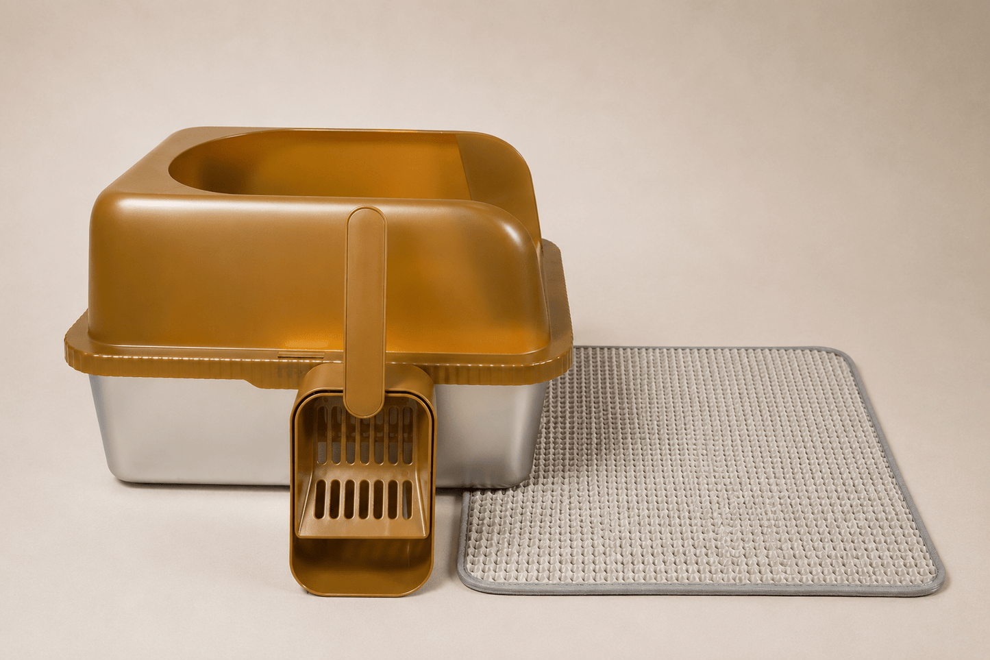 Gold high-wall cat litter box with scoop and textured anti-slip mat